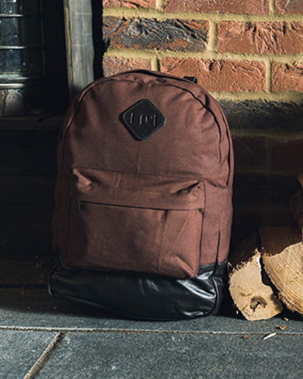 Brown coloured Jack Pyke Canvas Back Pack on brick wall background #colour_brown