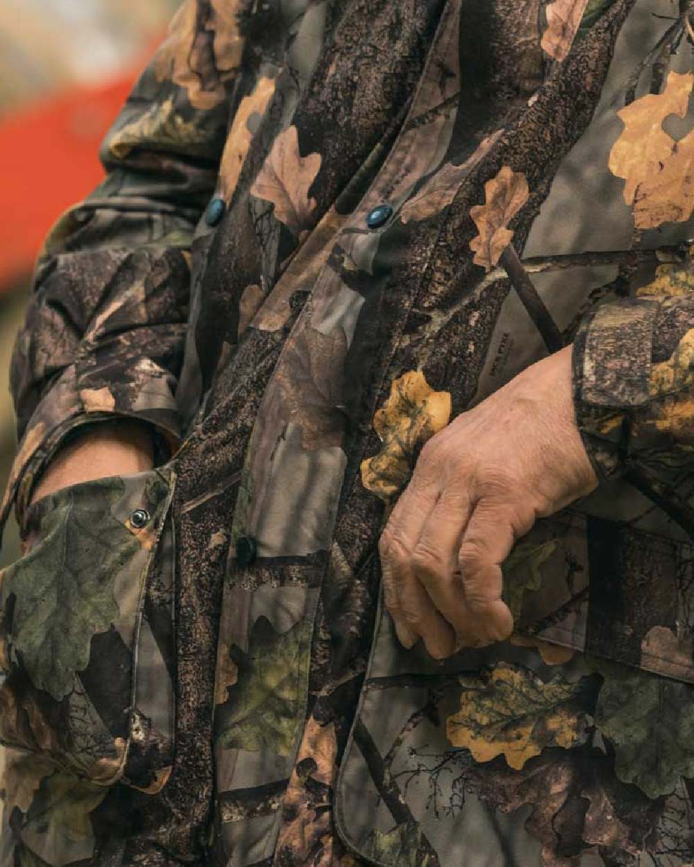 EVO coloured Jack Pyke Hunters Jacket on blurry background #colour_evo