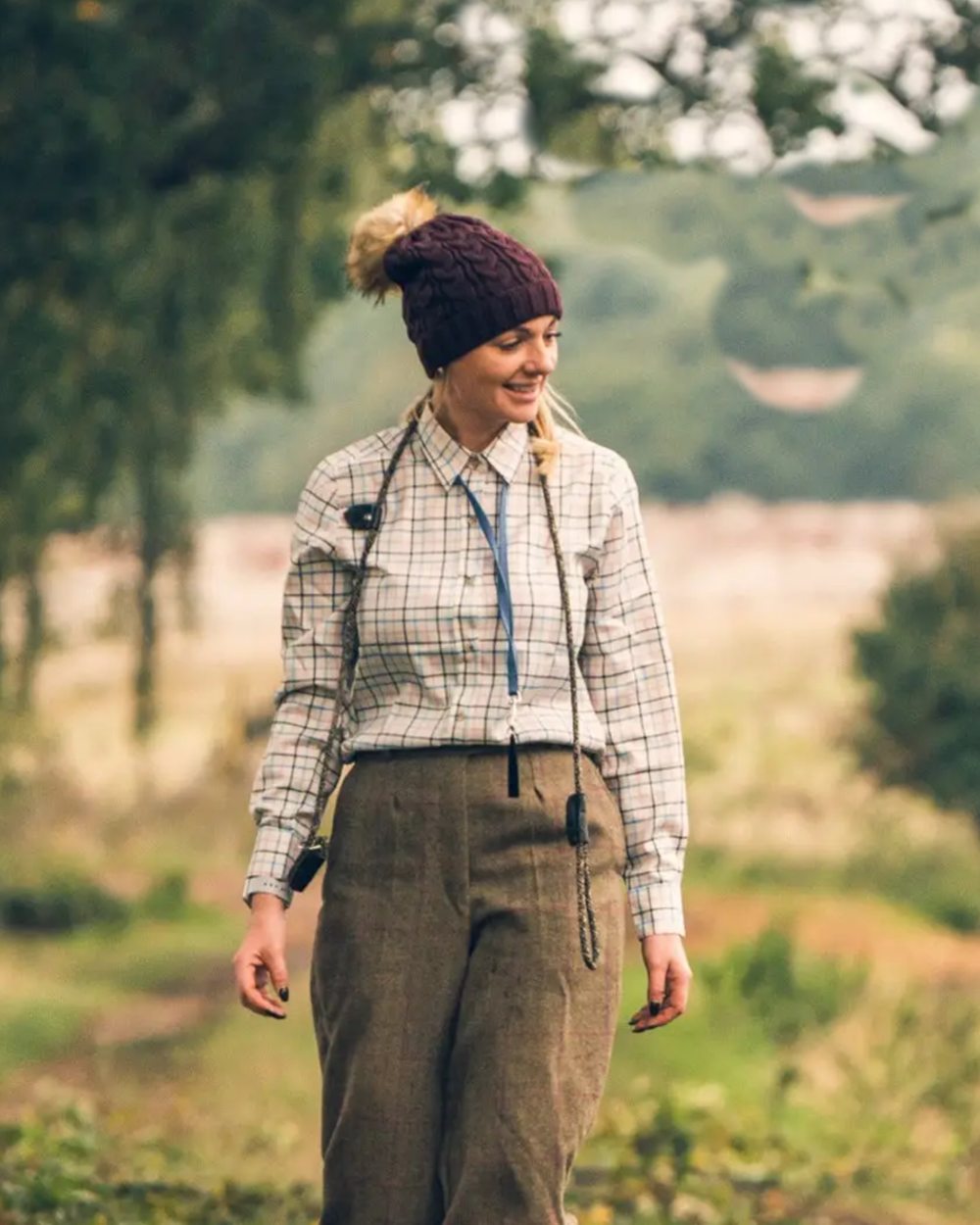 Navy coloured Jack Pyke Ladies Countryman Shirt on blurry background #colour_navy