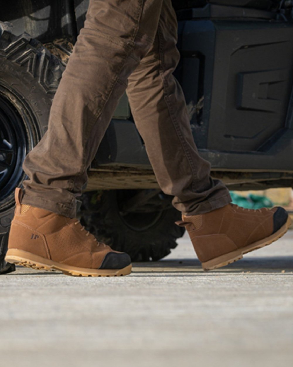 Brown coloured Jack Pyke Lowland Boots on car background #colour_brown