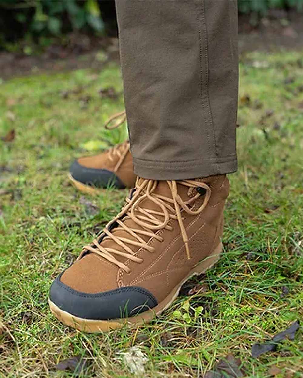 Brown coloured Jack Pyke Lowland Boots on grassy background #colour_brown