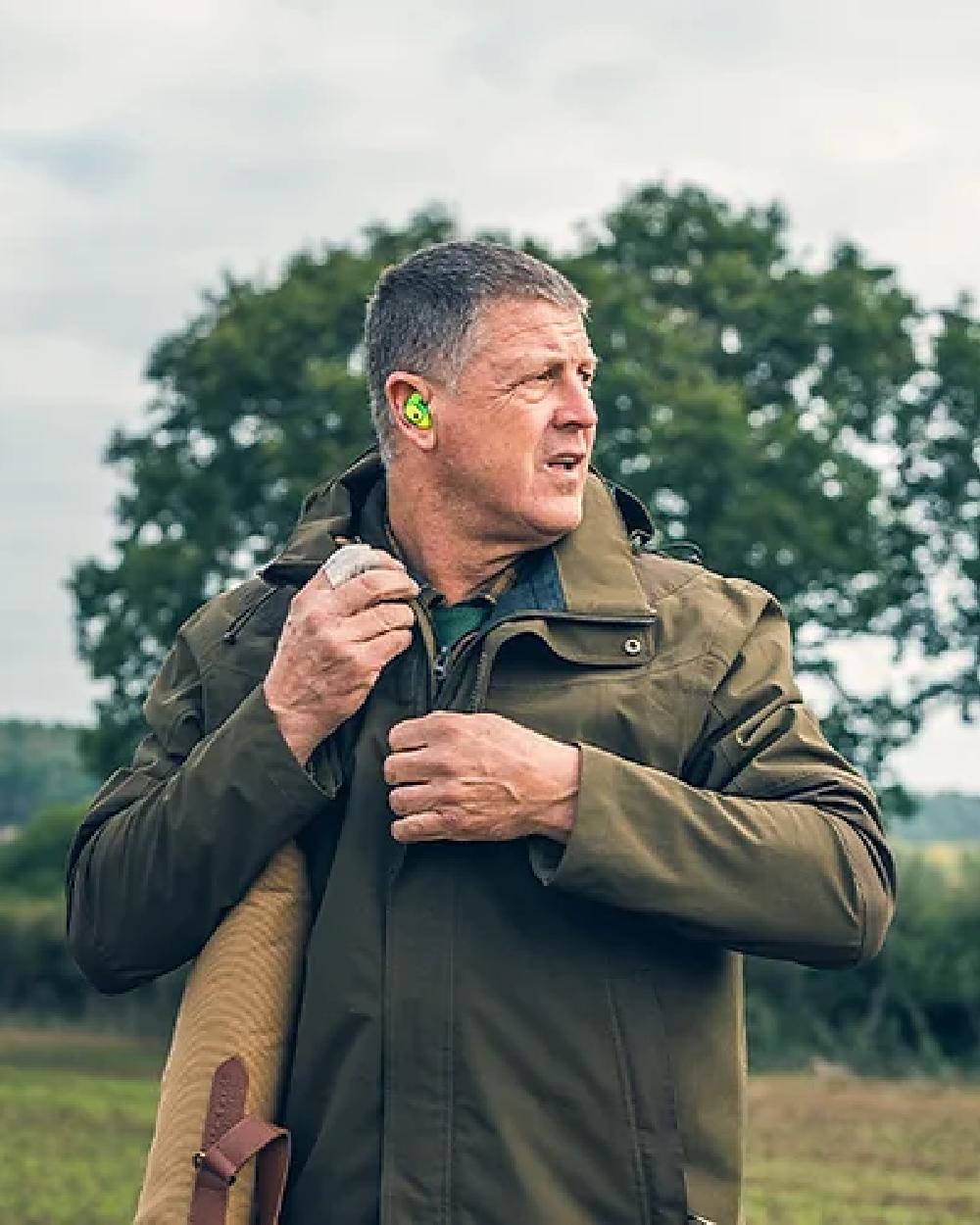 Green coloured Jack Pyke Pro-Lite Hunters Jacket on tree background #colour_green