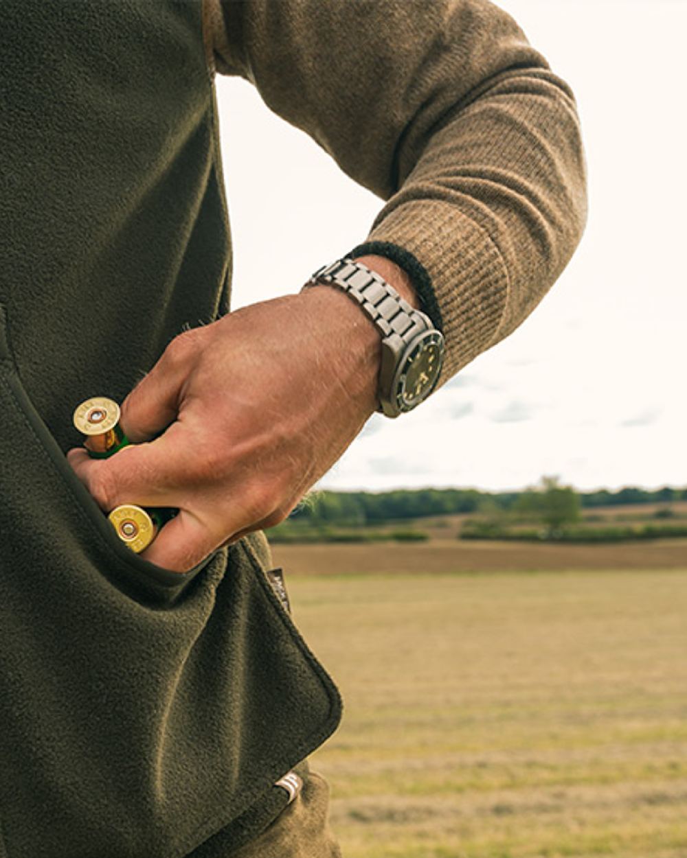 Dark Olive Jack Pyke Shooters Gilet on sky background #colour_dark-olive