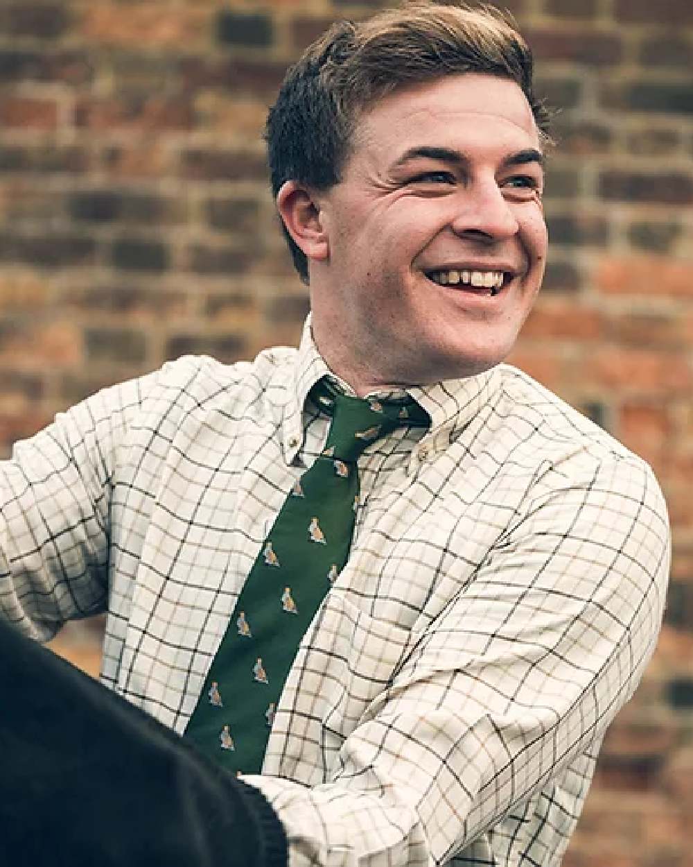 Green coloured Jack Pyke Shooting Tie Partridge on blurry background #colour_green