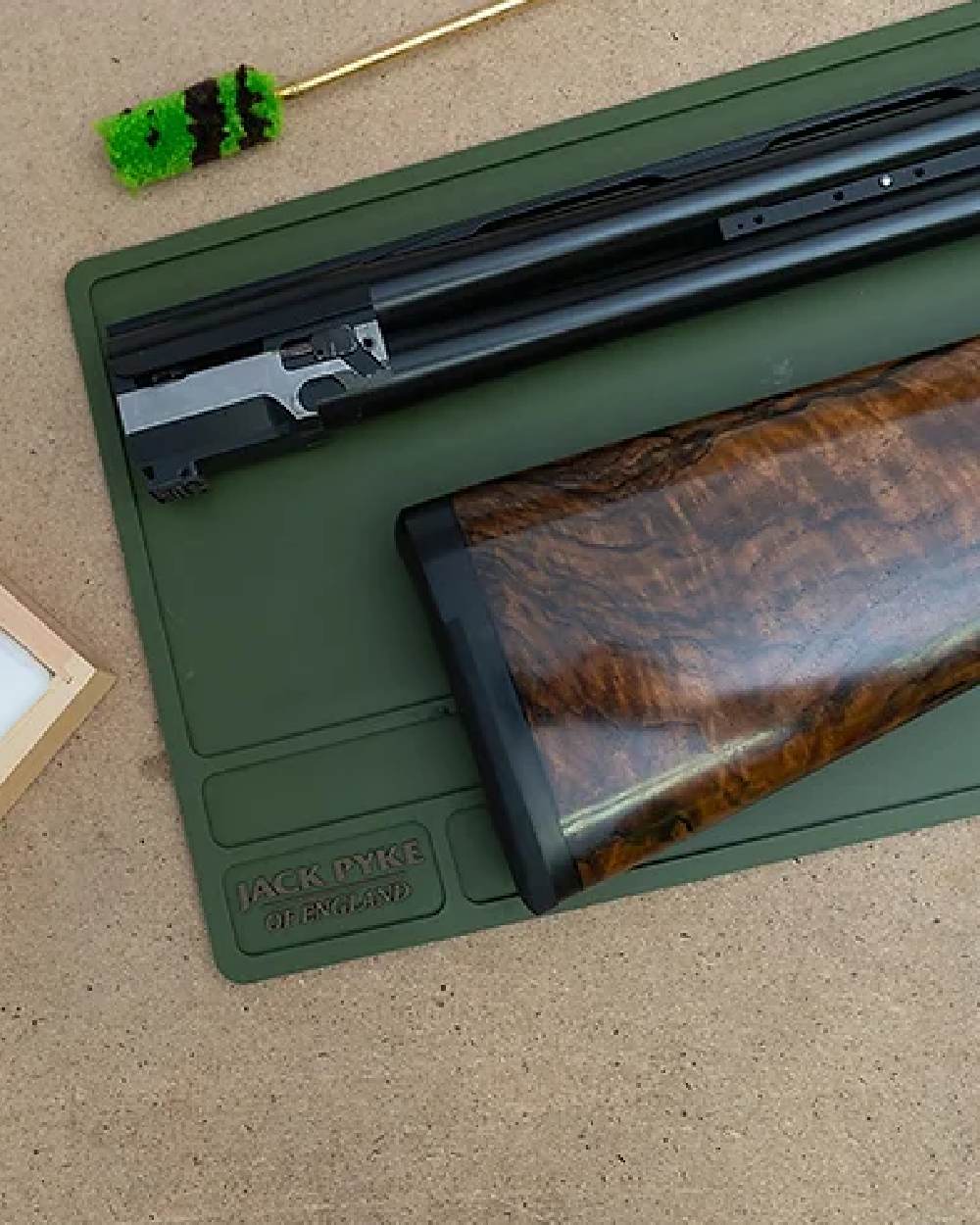 Green coloured Jack Pyke Silicone Gun Maintenance Mat on table background #colour_green