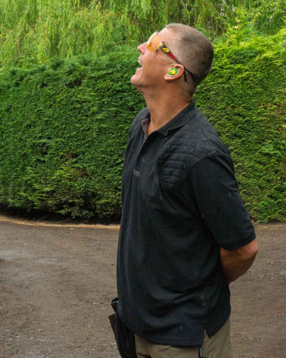 Black coloured Jack Pyke Sporting Polo Shirt on road background #colour_black