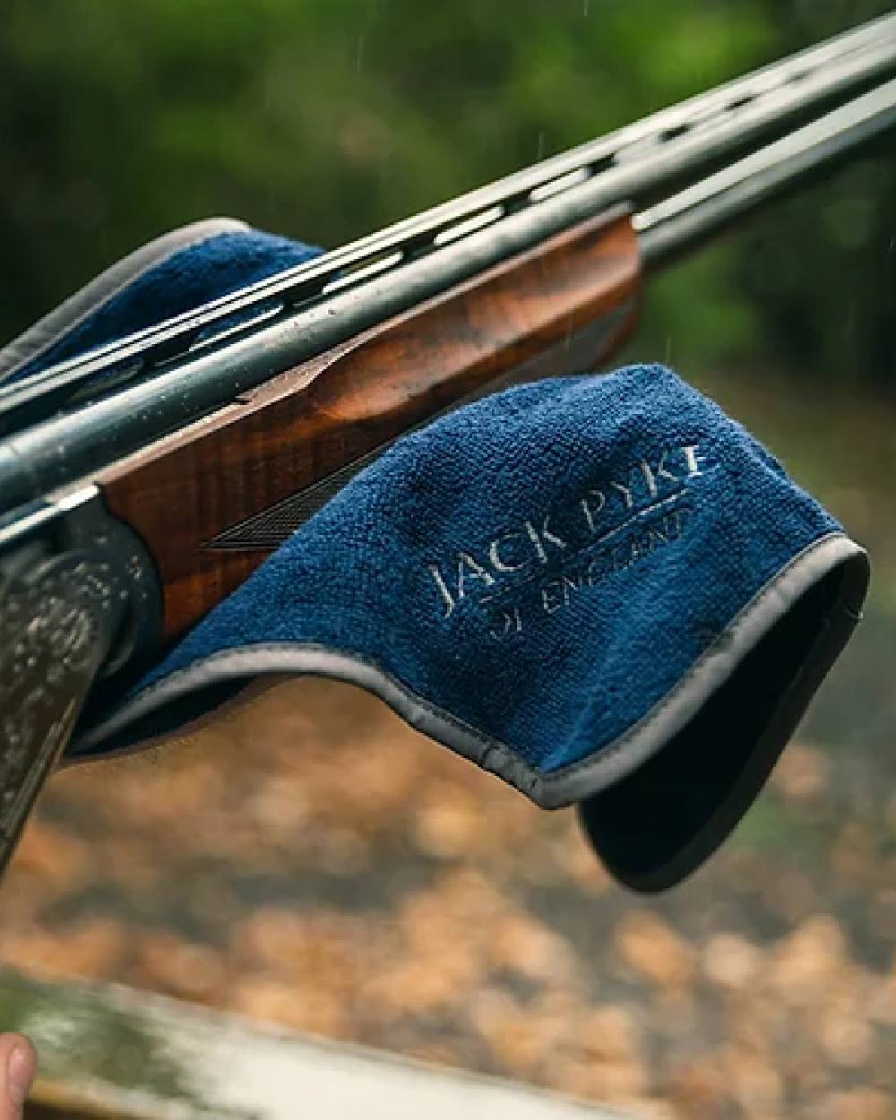 Blue coloured Jack Pyke Sporting Shooters Towel on blurry background #colour_blue