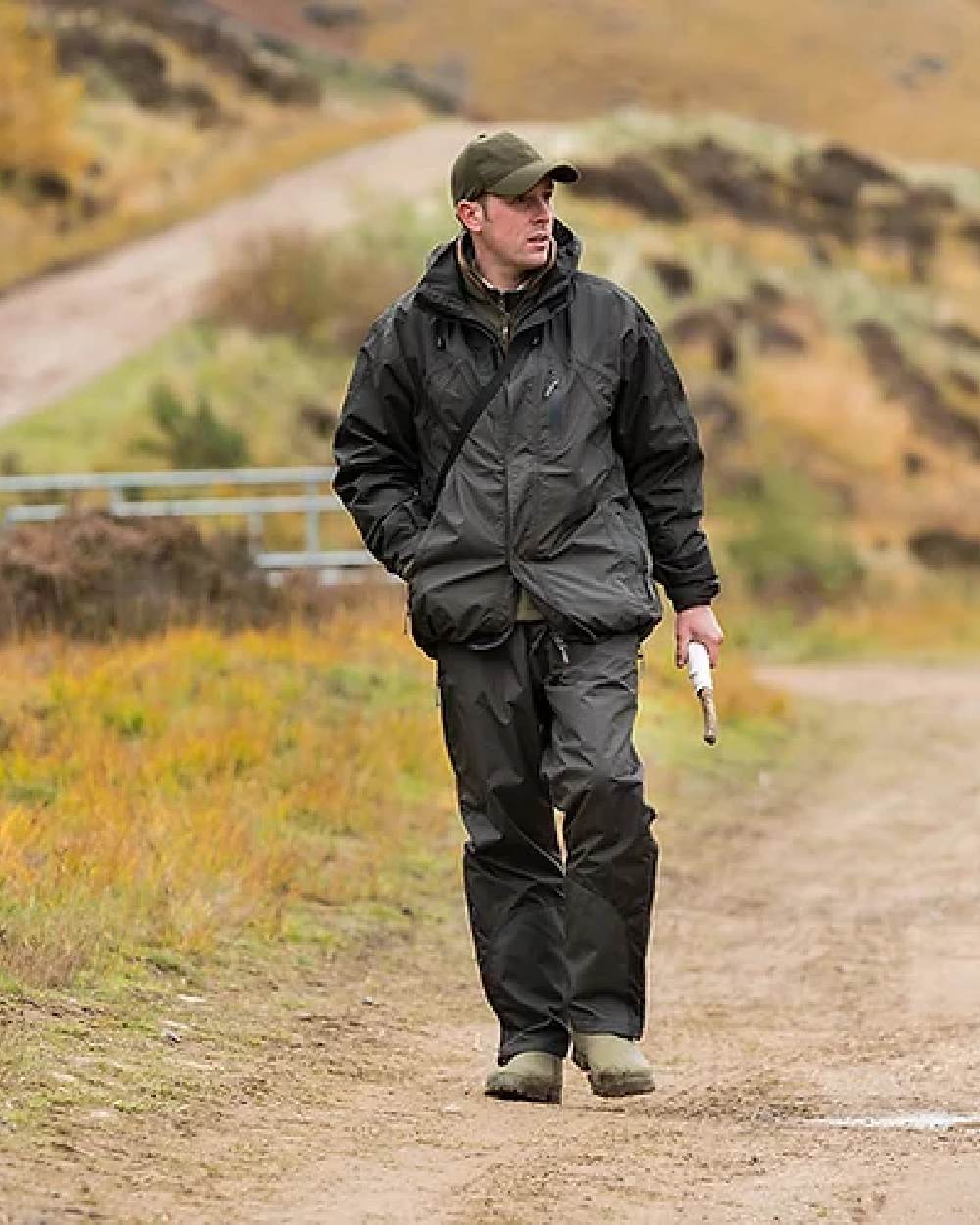 Hunter Green coloured Jack Pyke Technical Featherlite Jacket on mountain background #colour_hunter-green