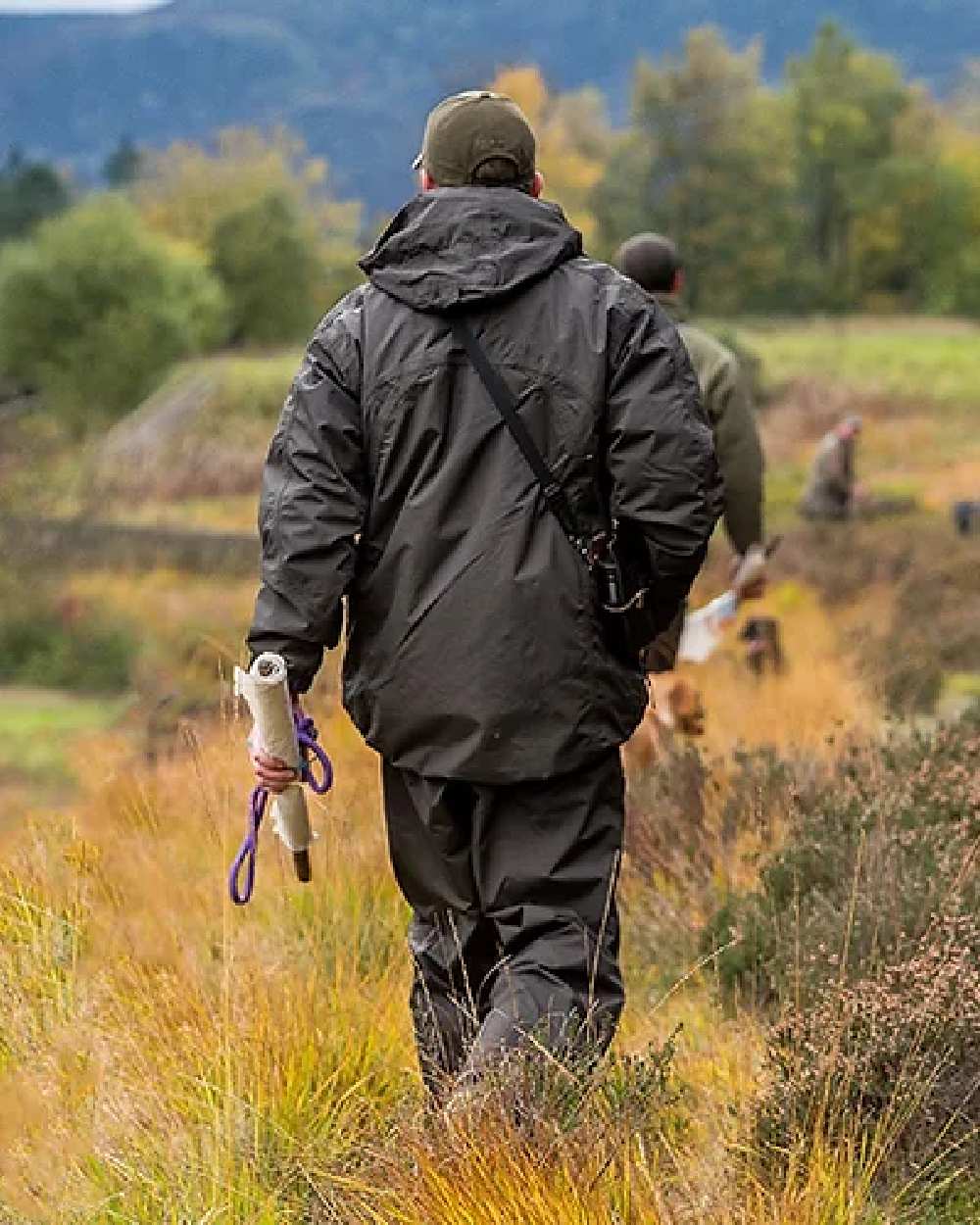 Hunter Green coloured Jack Pyke Technical Featherlite Jacket on mountain background #colour_hunter-green