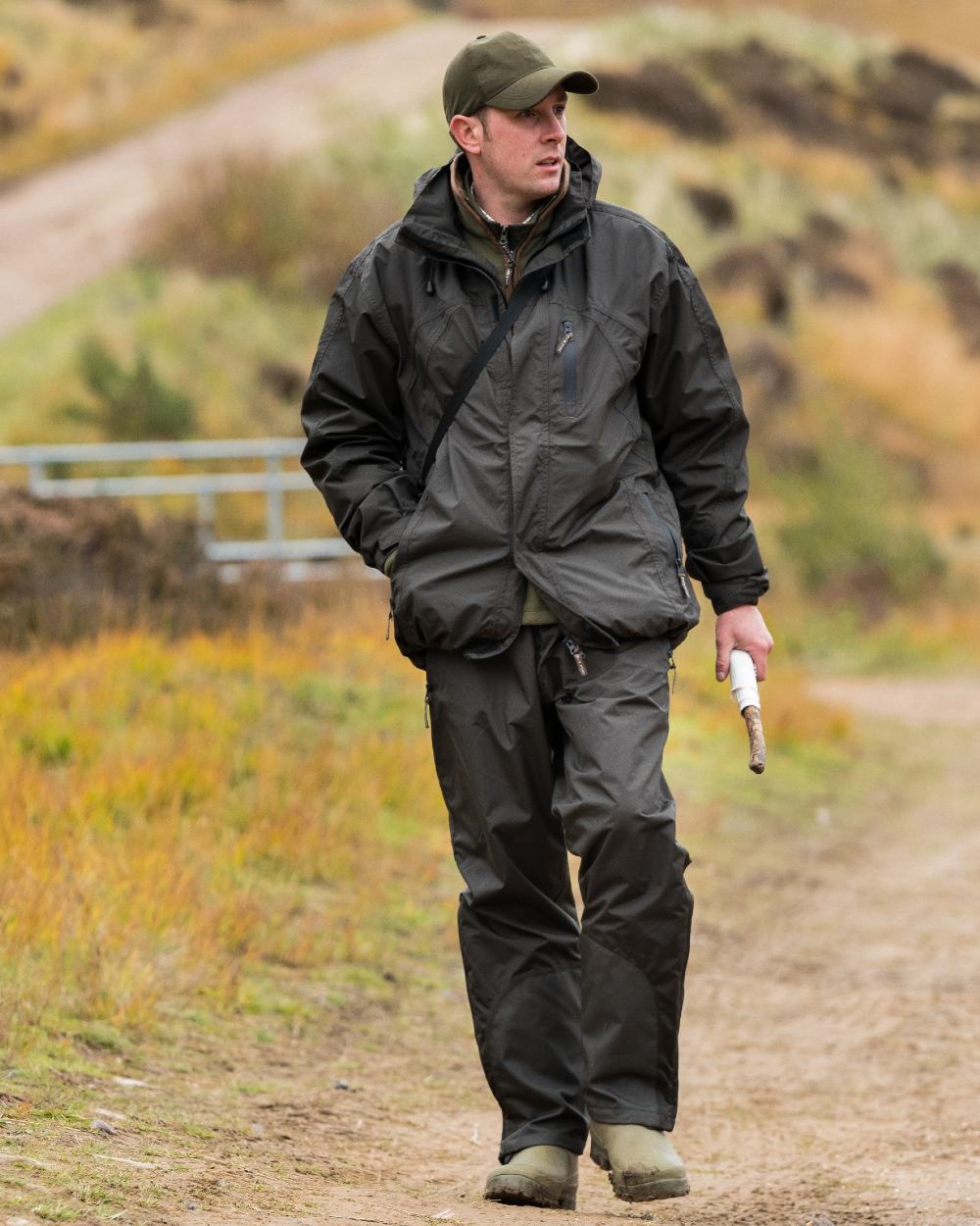 Hunters Green coloured Jack Pyke Technical Featherlite Trousers on mountain background #colour_hunter-green