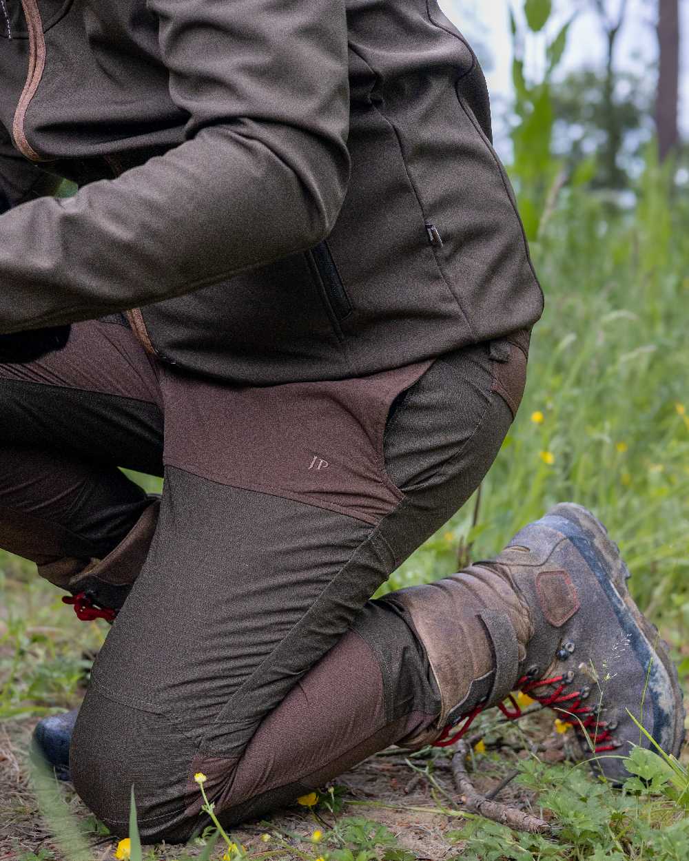 Brown coloured Jack Pyke Technical Hybrid Trousers on outdoor background #colour_brown