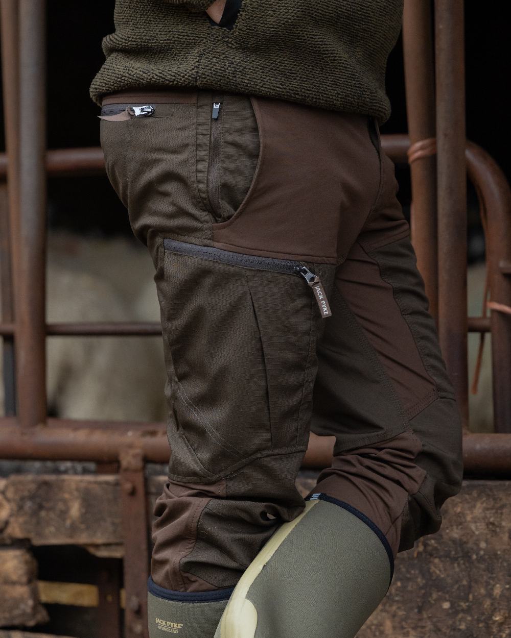 Brown coloured Jack Pyke Technical Hybrid Trousers on outdoor background #colour_brown