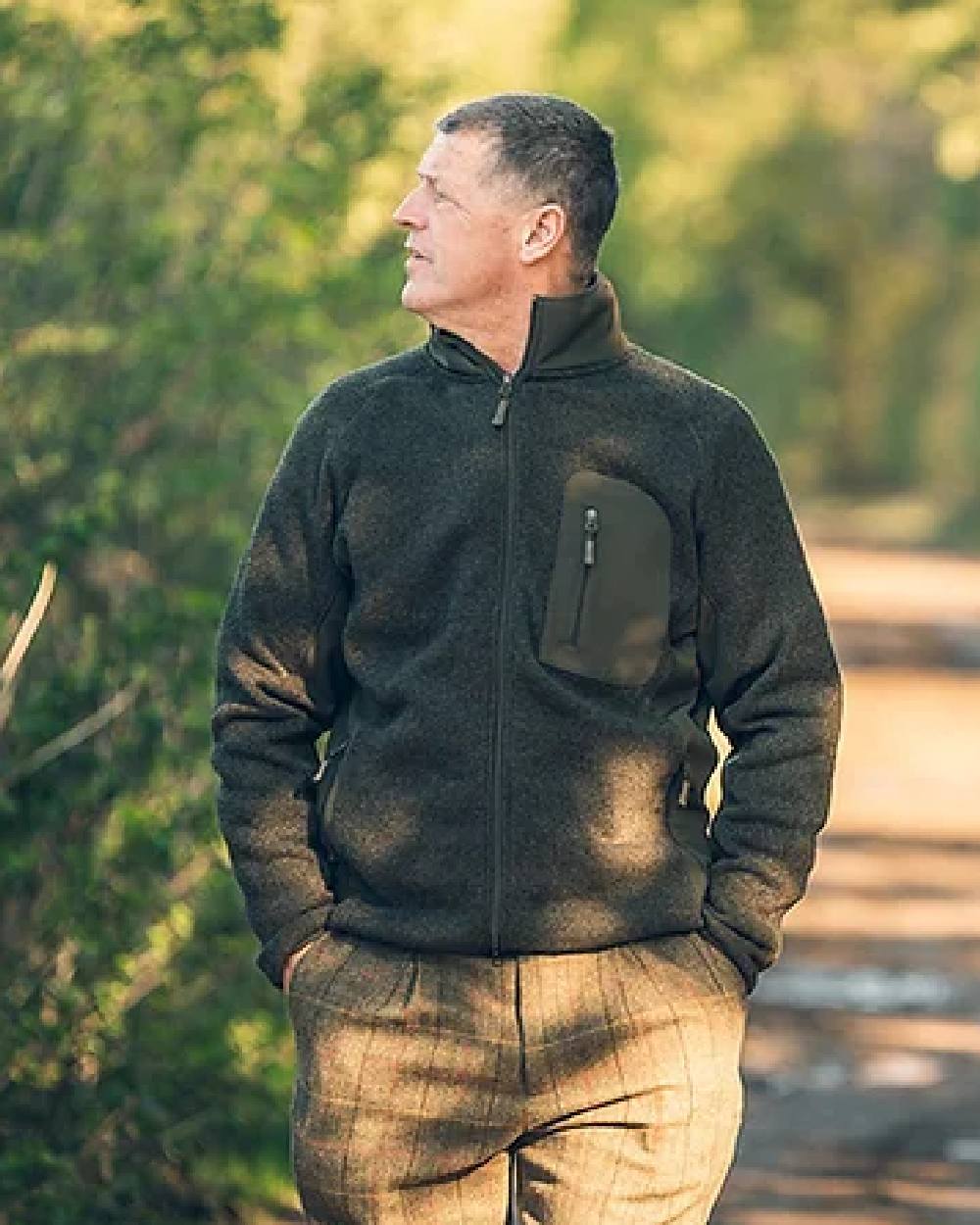 Green coloured Jack Pyke Weardale Knitted Jacket on blurry background #colour_green