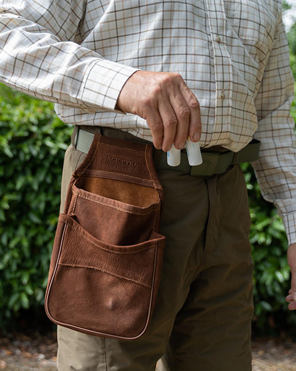 Brown coloured Jack Pyke Nubuck Cartridge Pouch on outdoor background #colour_brown