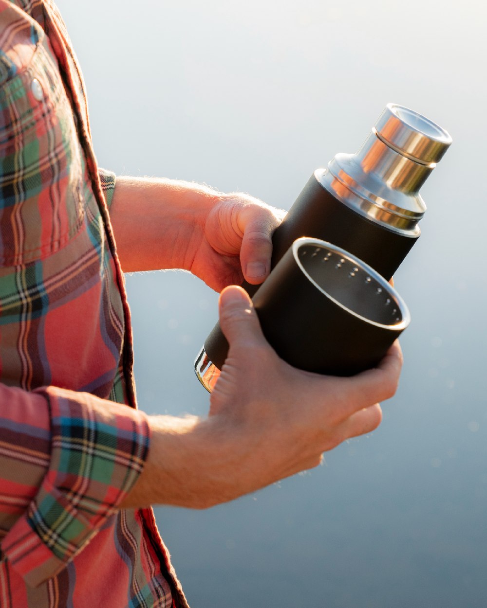 Black coloured Klean Kanteen Insulated TKPro Flask on sky background #colour_black