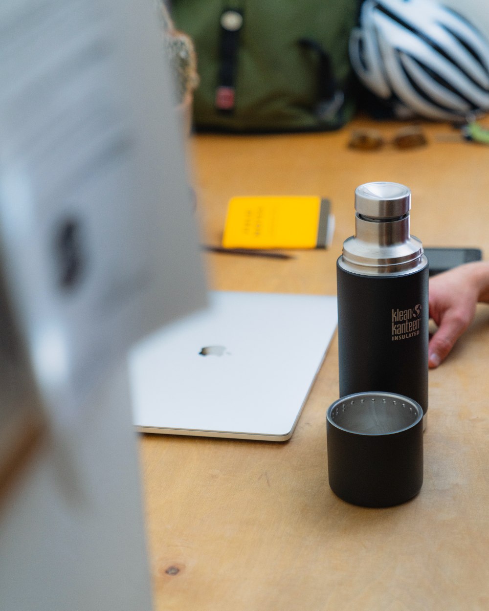 Black coloured Klean Kanteen Insulated TKPro Flask on desk background #colour_black