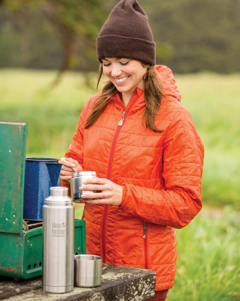 Brushed Stainless coloured Klean Kanteen Insulated TKPro Flask on forest background #colour_brushed-stainless