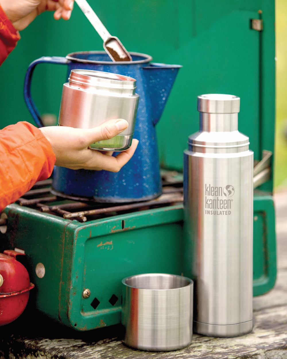 Brushed Stainless coloured Klean Kanteen Insulated TKPro Flask on forest background #colour_brushed-stainless