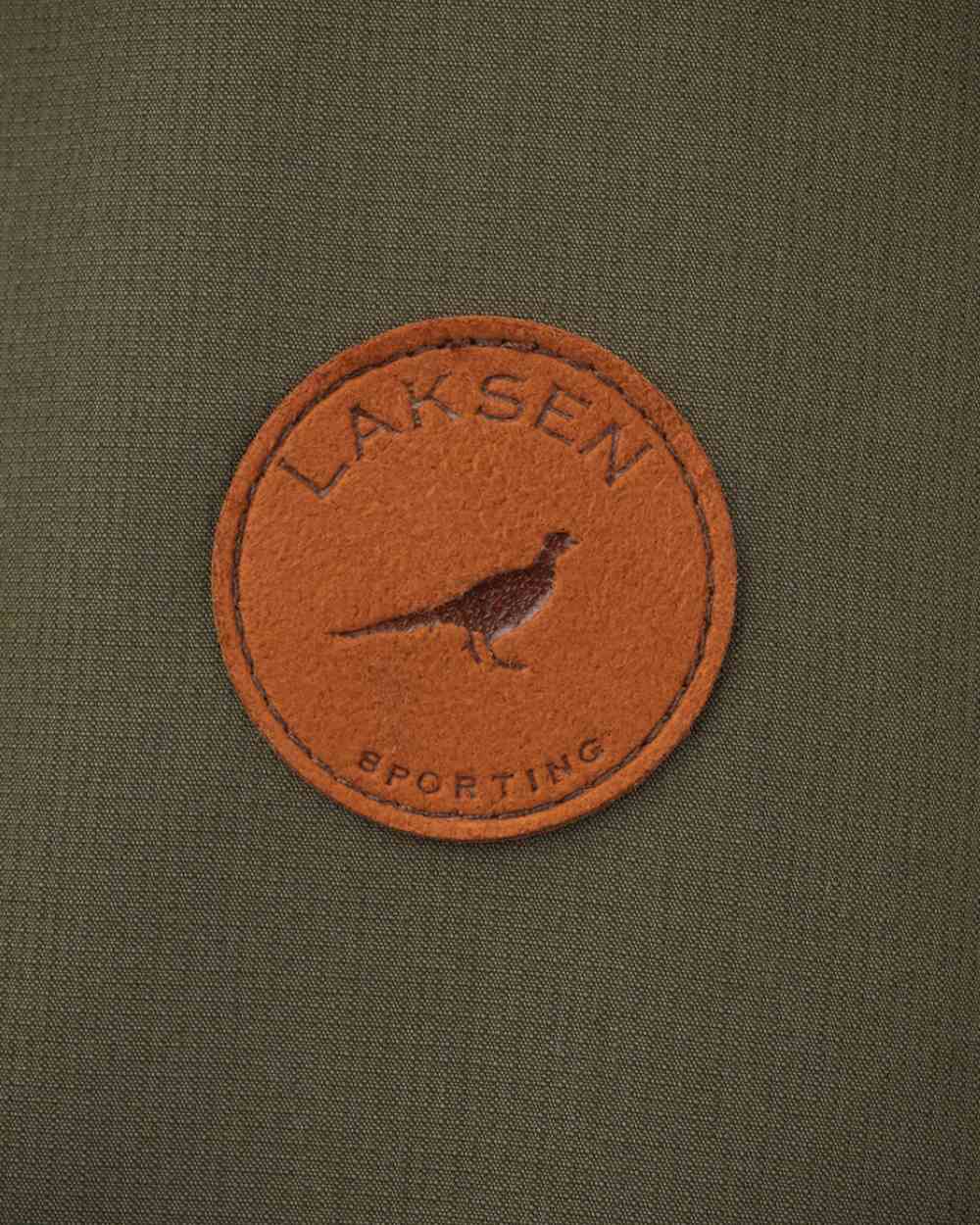 Olive Coloured Laksen Marsh Shooting Coat With CTX On A White Background