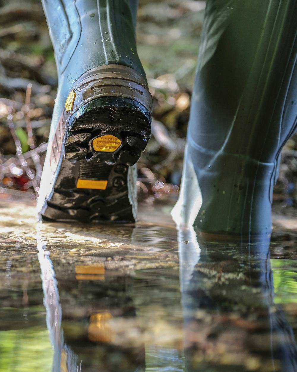 Green coloured Percussion Chantilly Full Zip Wellington Boots on water background #colour_green