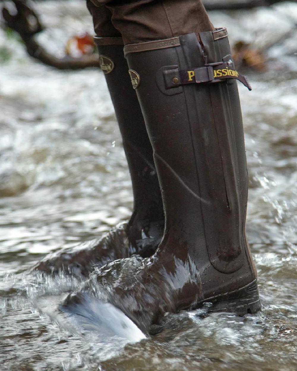 Brown coloured Percussion Rambouillet Full Zip Wellington Boots on water background #colour_brown