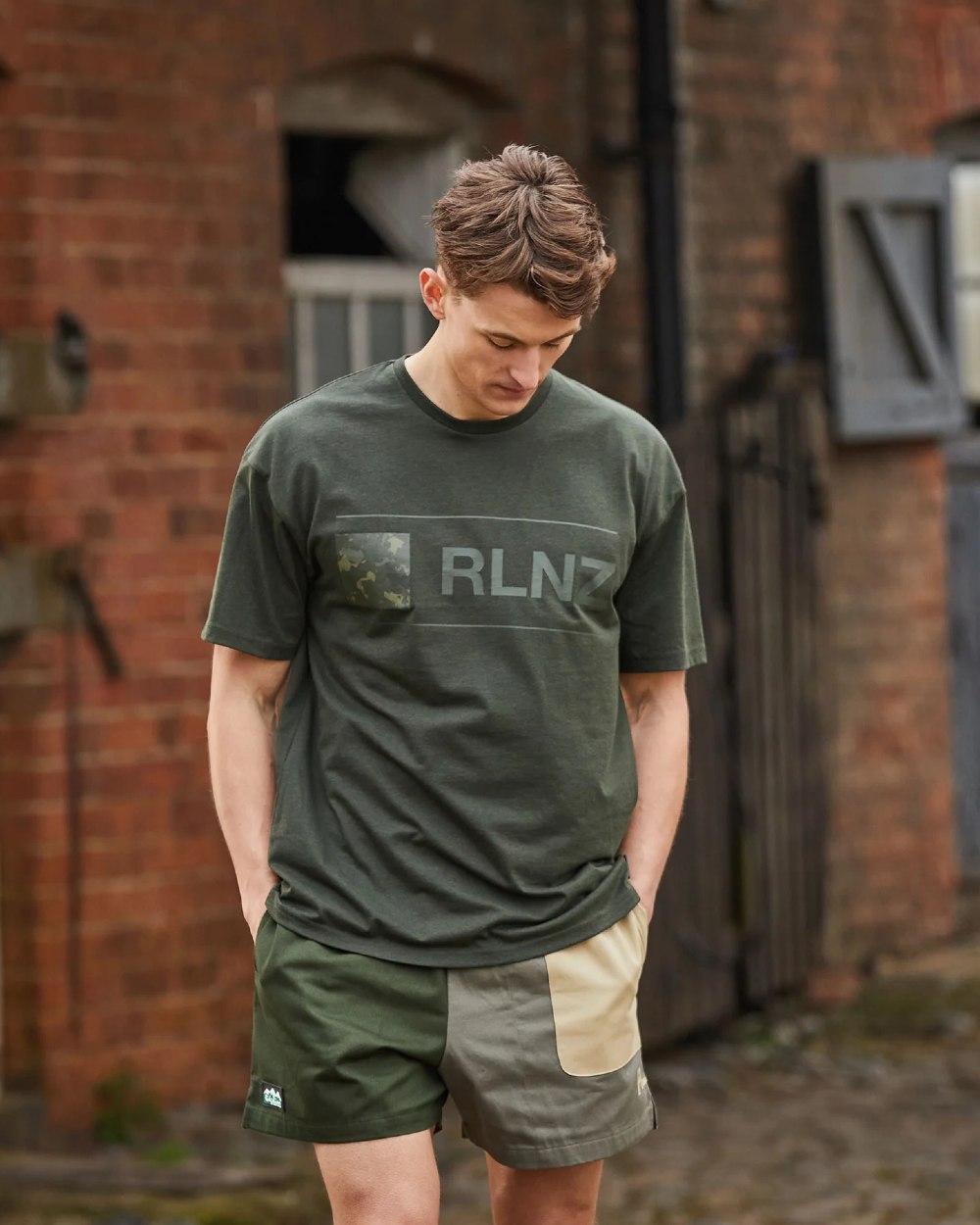 Olive Multi coloured Ridgeline Backslider Shorts on house background #colour_olive-multi