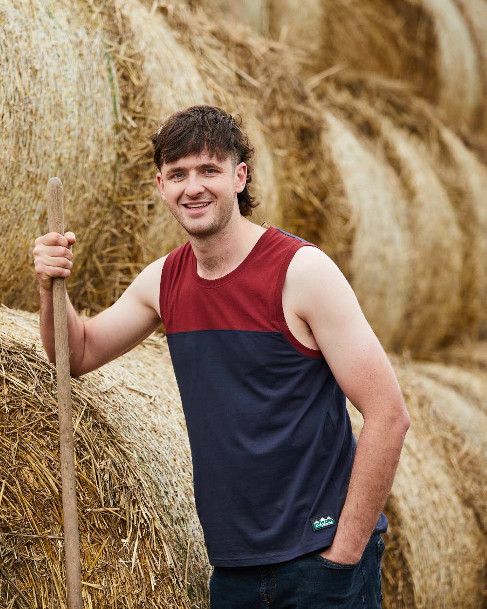 Navy Multi coloured Ridgeline Backslider Singlet Top on haystack background #colour_navy-multi
