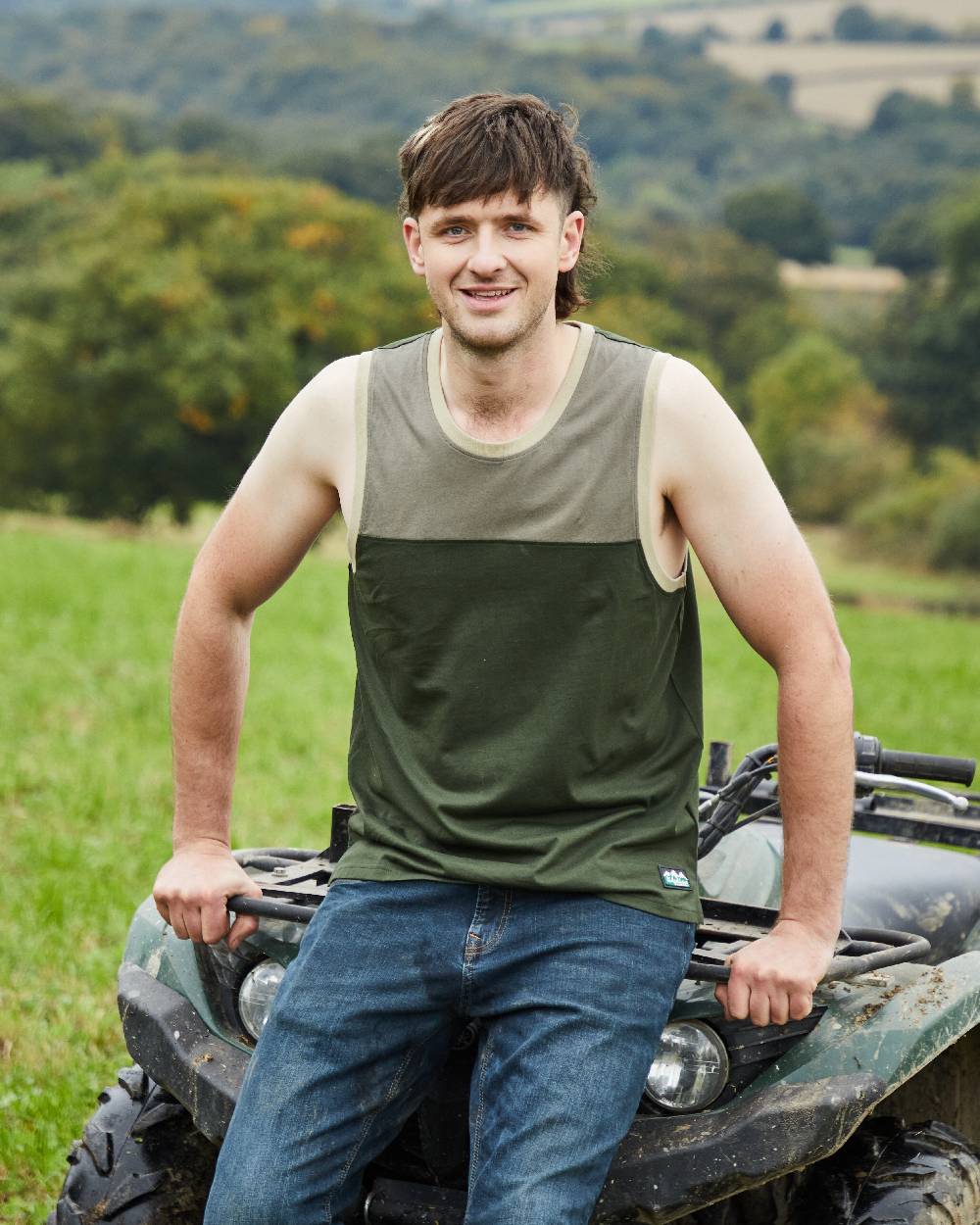 Olive Multi coloured Ridgeline Backslider Singlet Top on forest background #colour_olive-multi