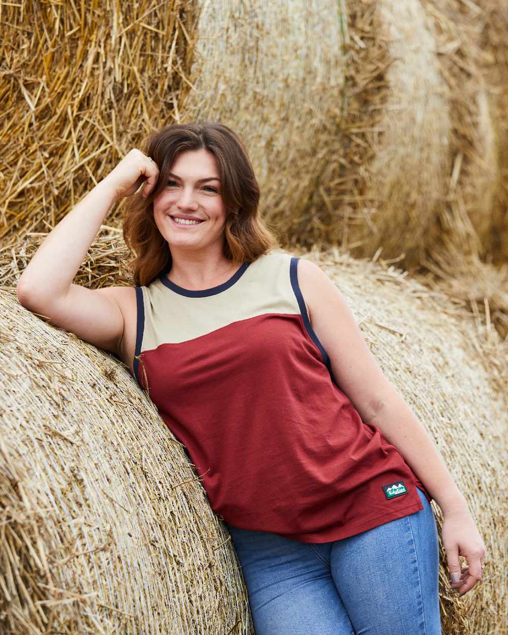 Rhubarb Multi coloured Ridgeline Backslider Singlet Top on haystack background #colour_rhubarb-multi