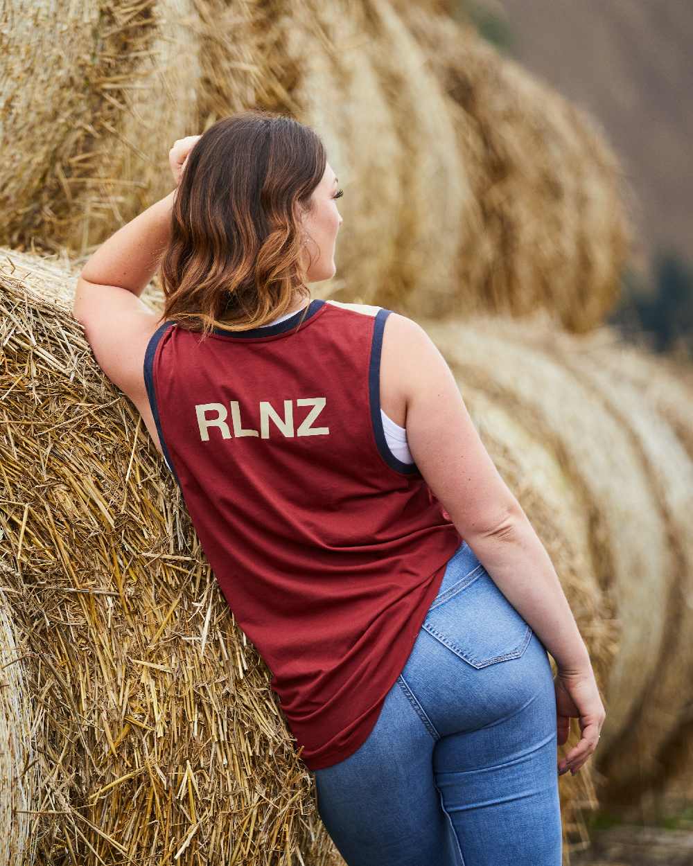 Rhubarb Multi coloured Ridgeline Backslider Singlet Top on haystack background #colour_rhubarb-multi