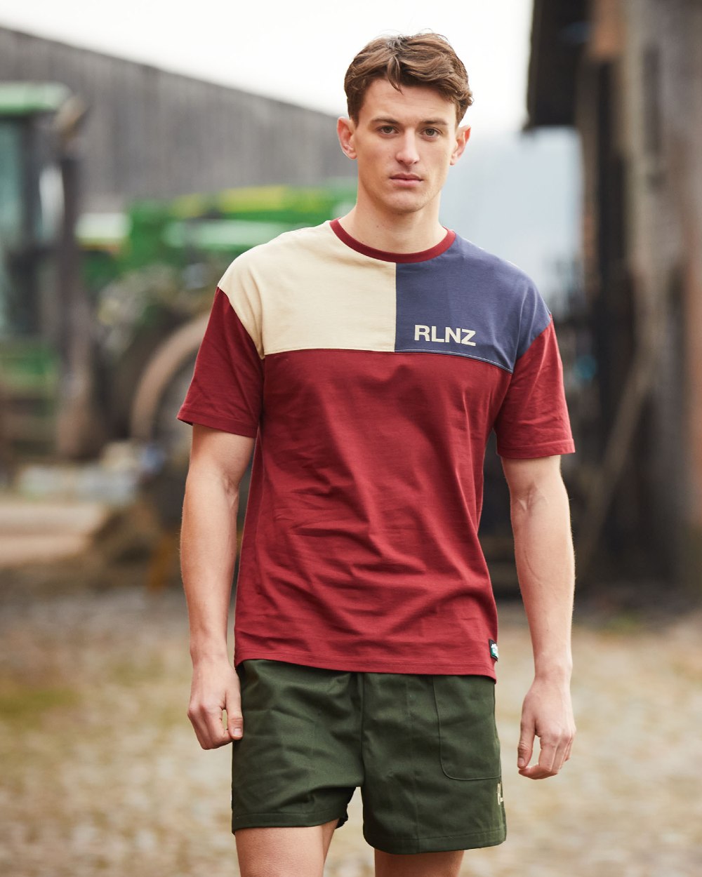 Rhubarb Multi coloured Ridgeline Backslider T-Shirt on blurry background #colour_rhubarb-multi