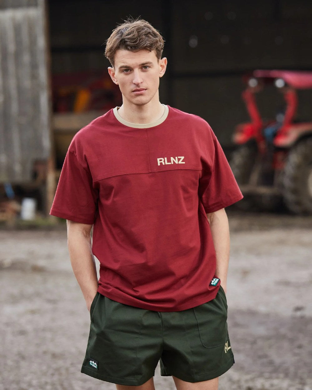 Olive coloured Ridgeline Hose Down Shorts on blurry background #colour_olive