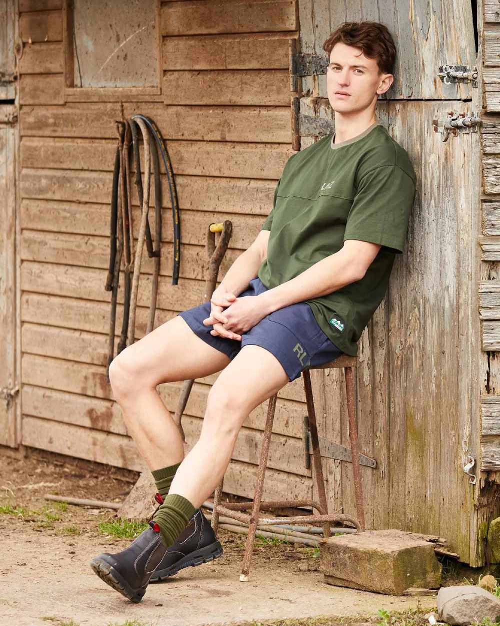 Olive coloured Ridgeline Hose Down T-Shirt on door background #colour_olive