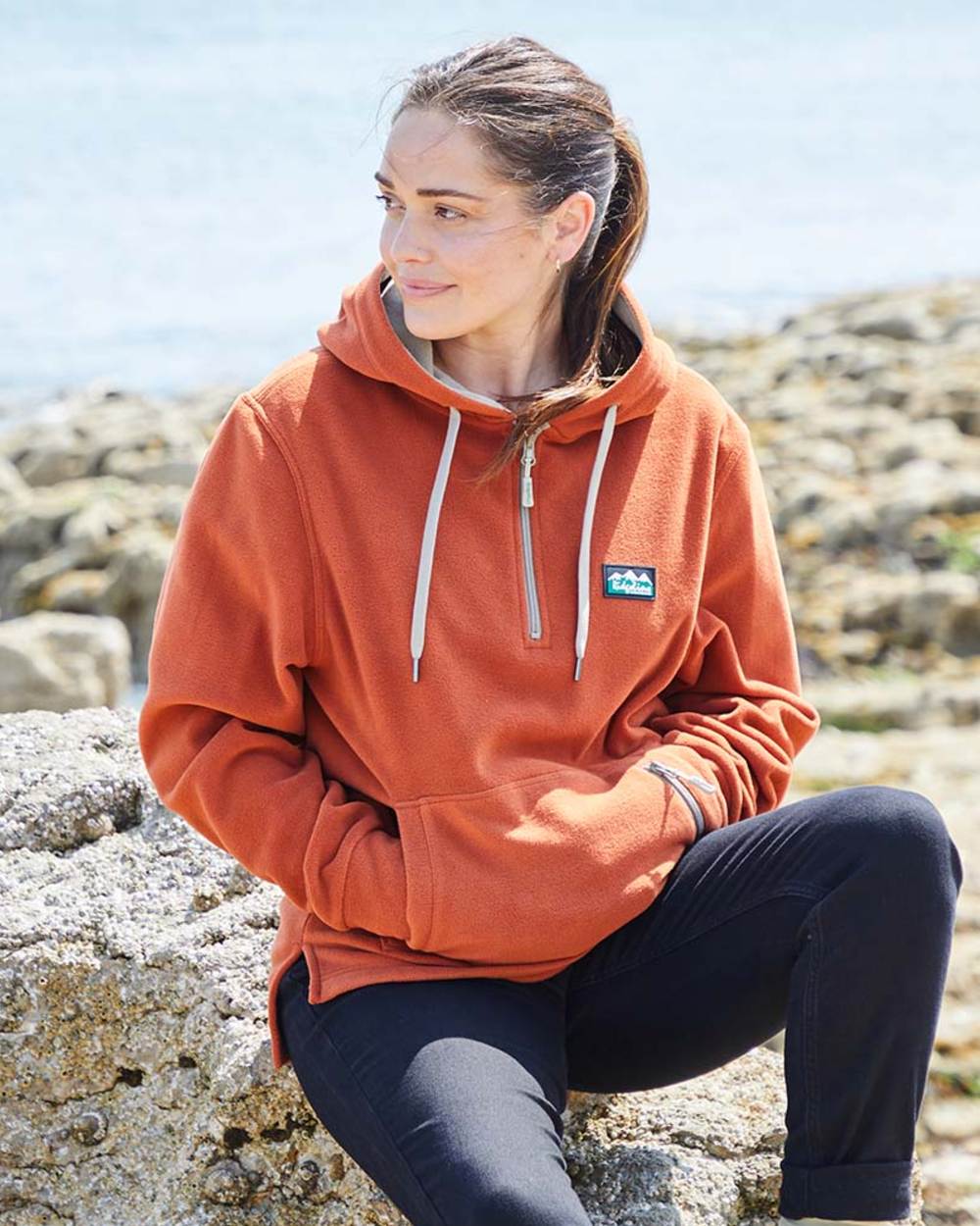 Russet coloured Ridgeline Ladies Ballistic Hoodie on sea background #colour_russet