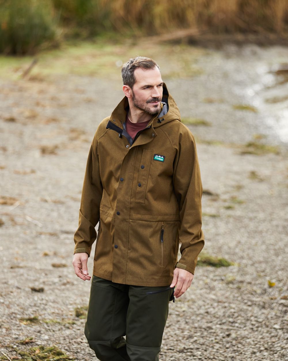 Teak coloured Ridgeline Mens Monsoon Light Jacket on street background #colour_teak