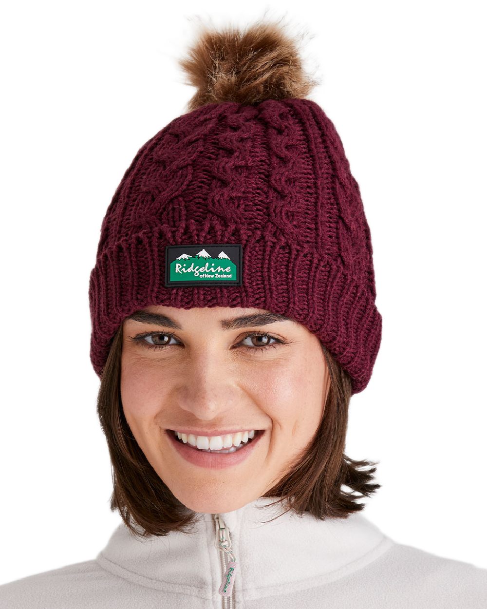 Winter Berry Coloured Ridgeline Nordic Fleck Bobble Hat on white background #colour_winter-berry
