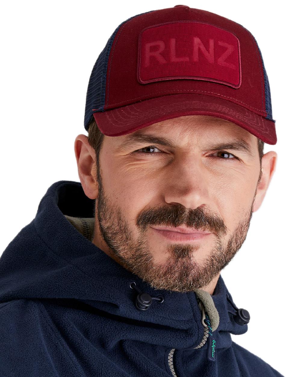 Rhubarb Coloured Ridgeline RLNZ Trucker Cap on white background #colour_rhubarb