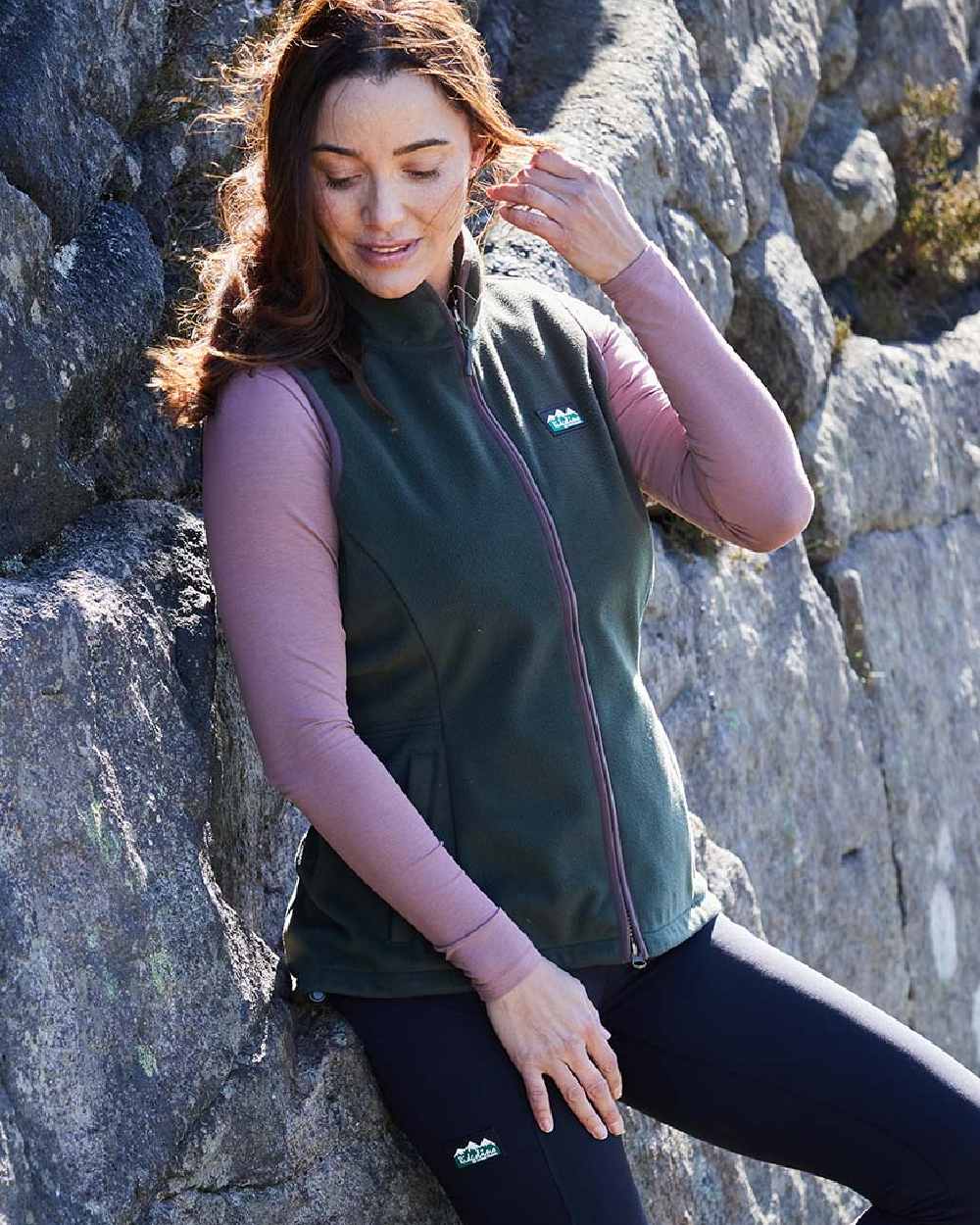 Deep Forest coloured Ridgeline Womens Kodiak Gilet on mountain background #colour_deep-forest