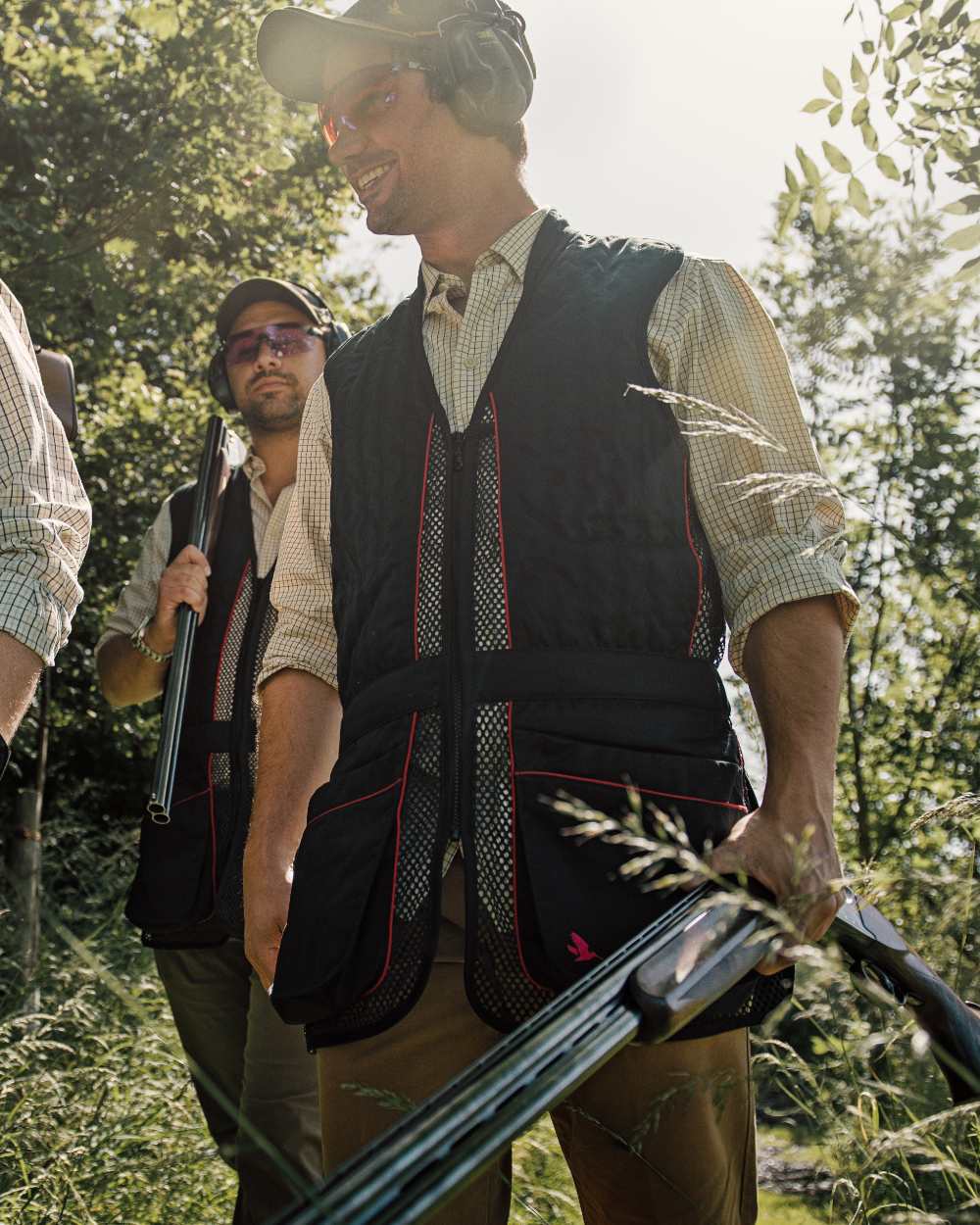 Black coloured Seeland Skeet II Waistcoat on forest background #colour_black