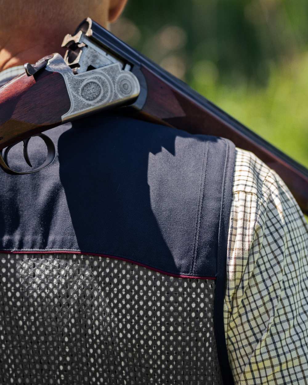 Classic Blue coloured Seeland Skeet II Waistcoat on forest background #colour_classic-blue