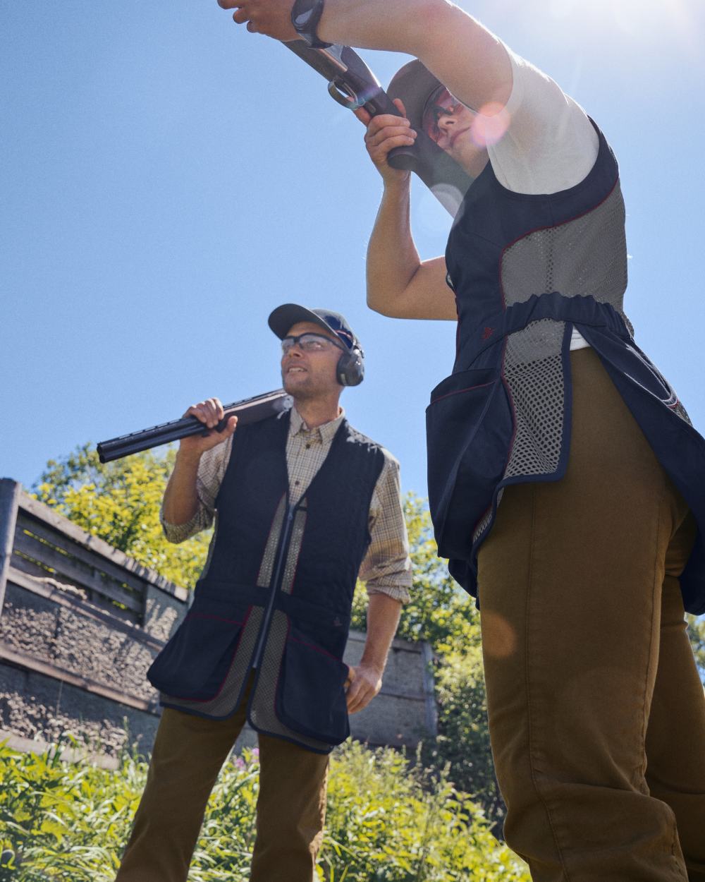 Classic Blue coloured Seeland Skeet II Waistcoat on forest background #colour_classic-blue