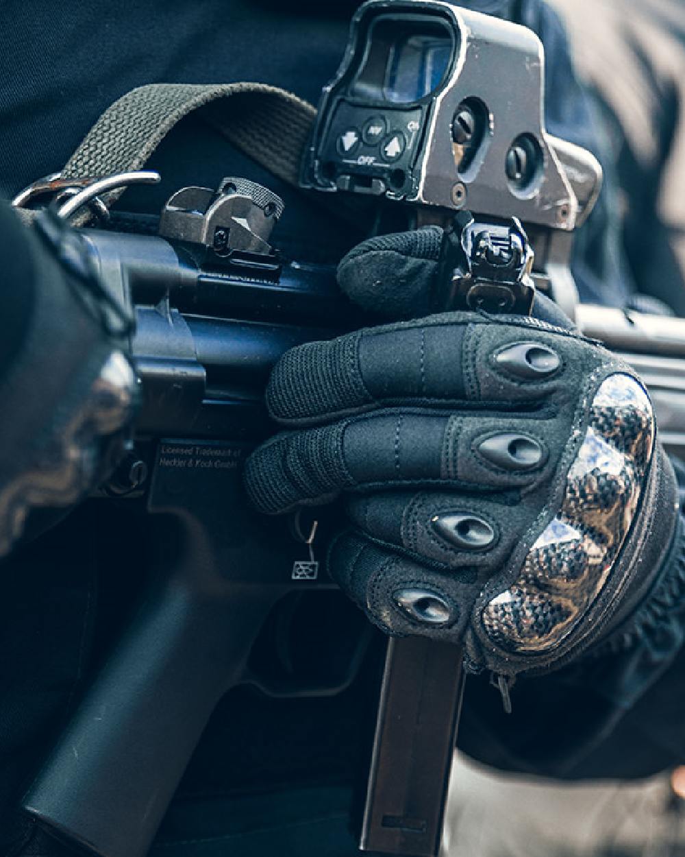 Black Coloured Viper Elite Gloves on blurry background #colour_black