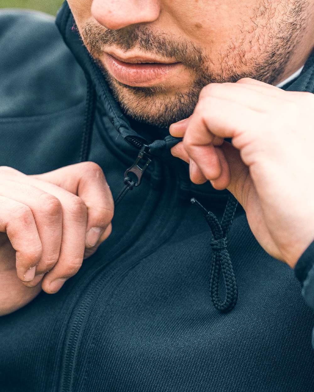 Black coloured Viper Storm Hoodie on blurry background #colour_black