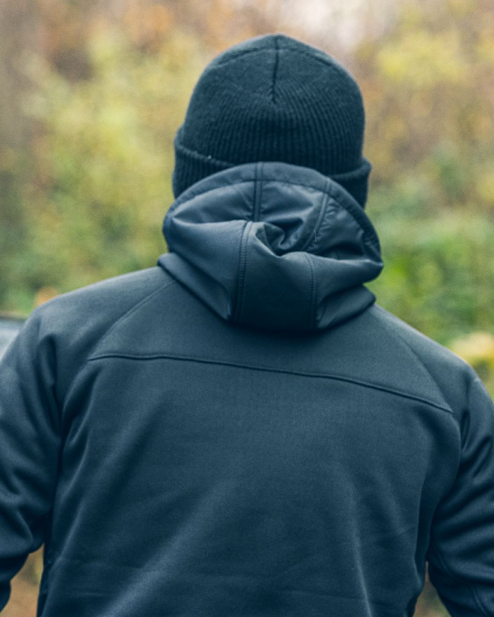 Black coloured Viper Storm Hoodie on blurry background #colour_black