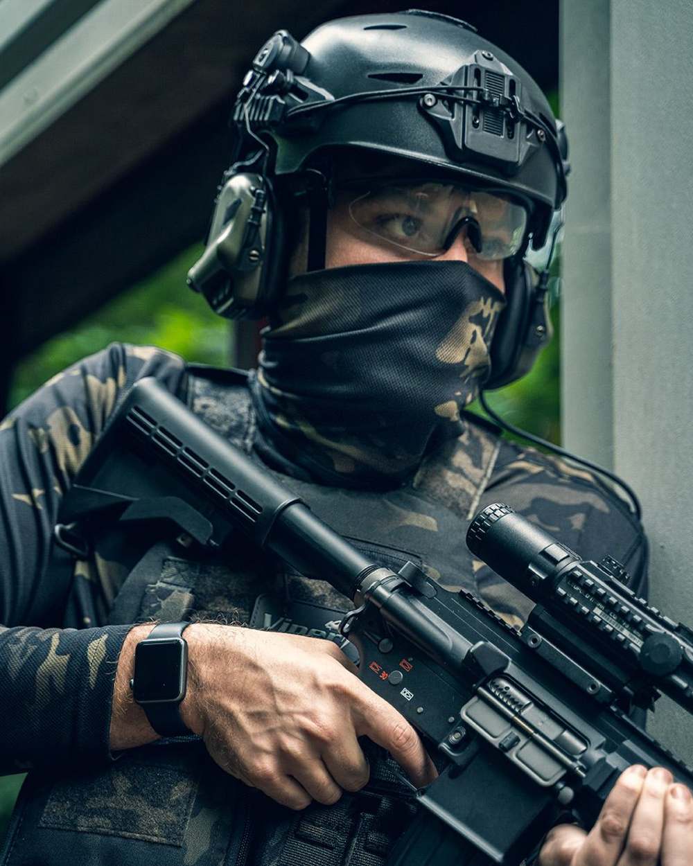 VCAM Black Coloured Viper Tactical Roll Neck Top on blurry background #colour_vcam-black
