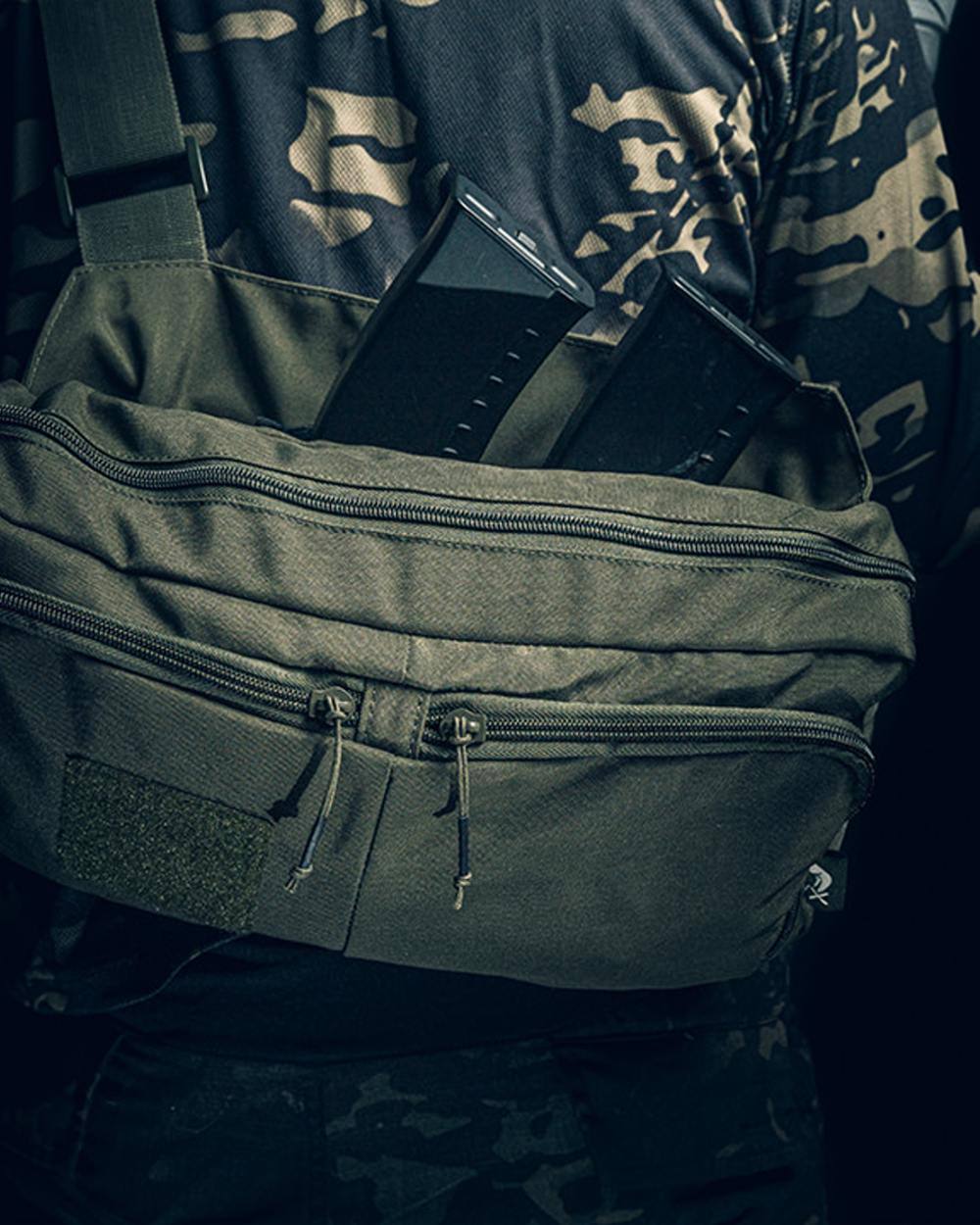 Green Coloured Viper VX Buckle Up Sling Pack on blurry background #colour_green
