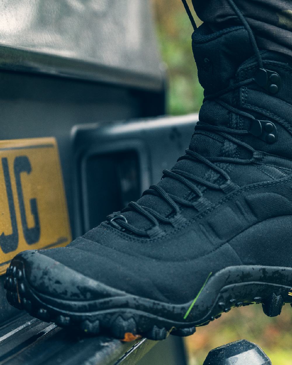 Black Coloured Viper Venom Boots on car background #colour_black