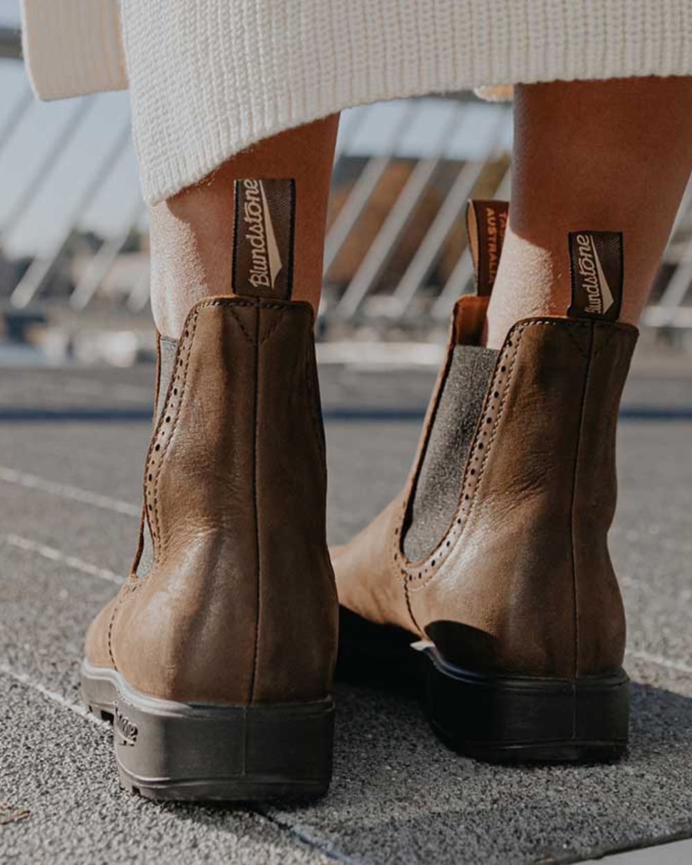 Antique Brown Coloured Blundstone Womens 2151 Antique Brown Leather Chelsea Boots On A Over Bridge Background #colour_antique-brown