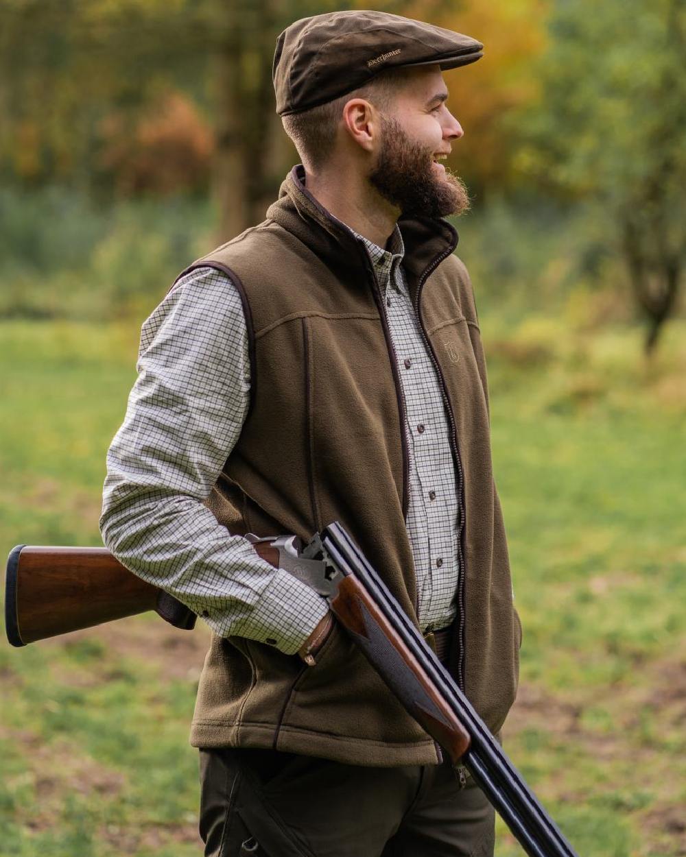 Tarmac Green Coloured Deerhunter Eagle Fleece Waistcoat On A Forest Background #colour_tarmac-green