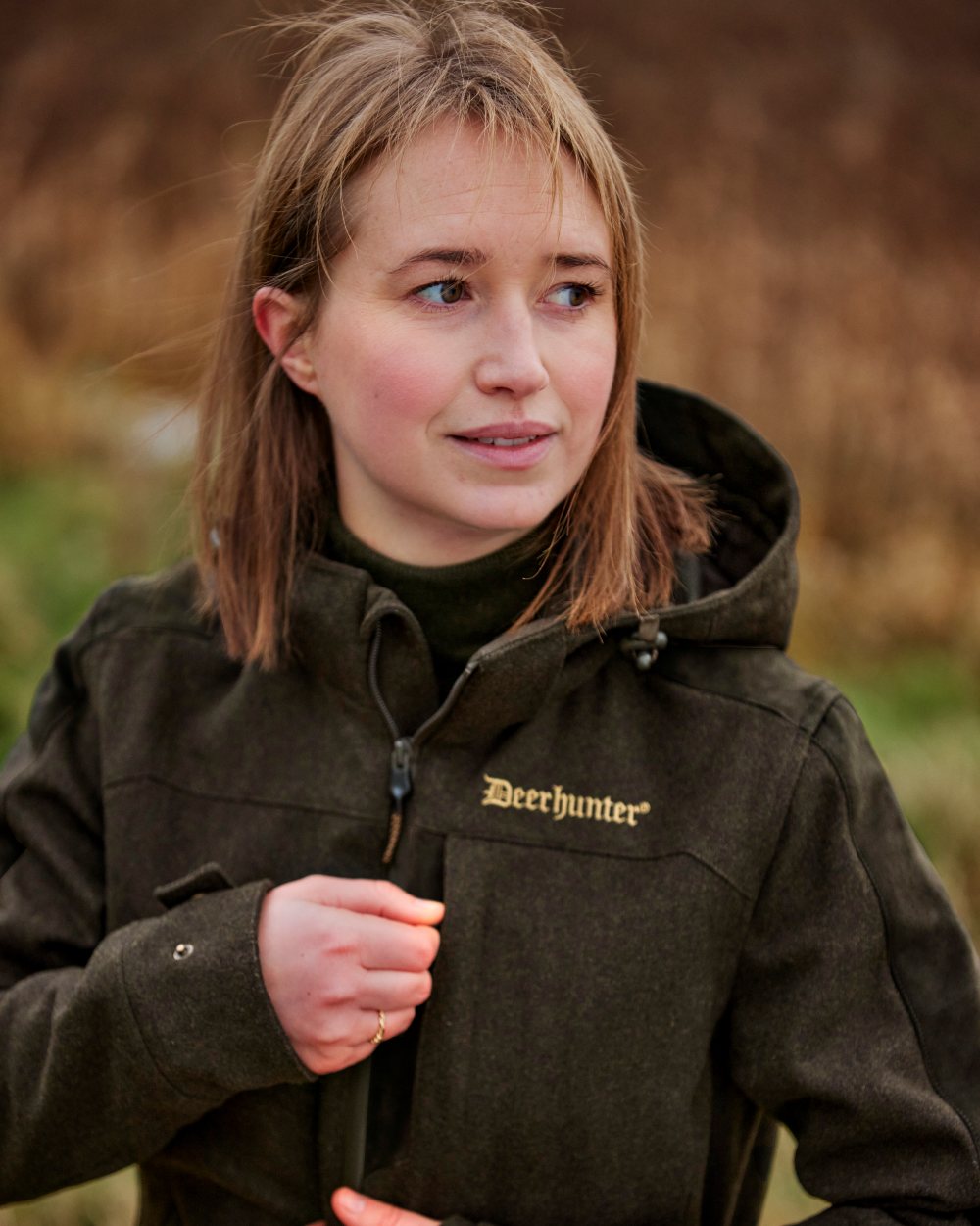 Loden Wood coloured Deerhunter Lady Tatra Active Jacket on Forest background #colour_loden-wood